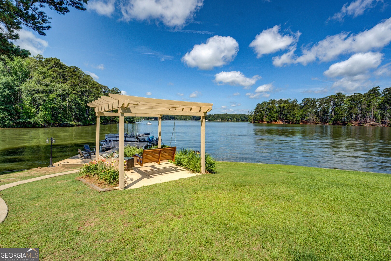 8950 Jackson Lake Road Monticello, GA 31064 - Photo 77 of 88 a view of a lake with a big yard