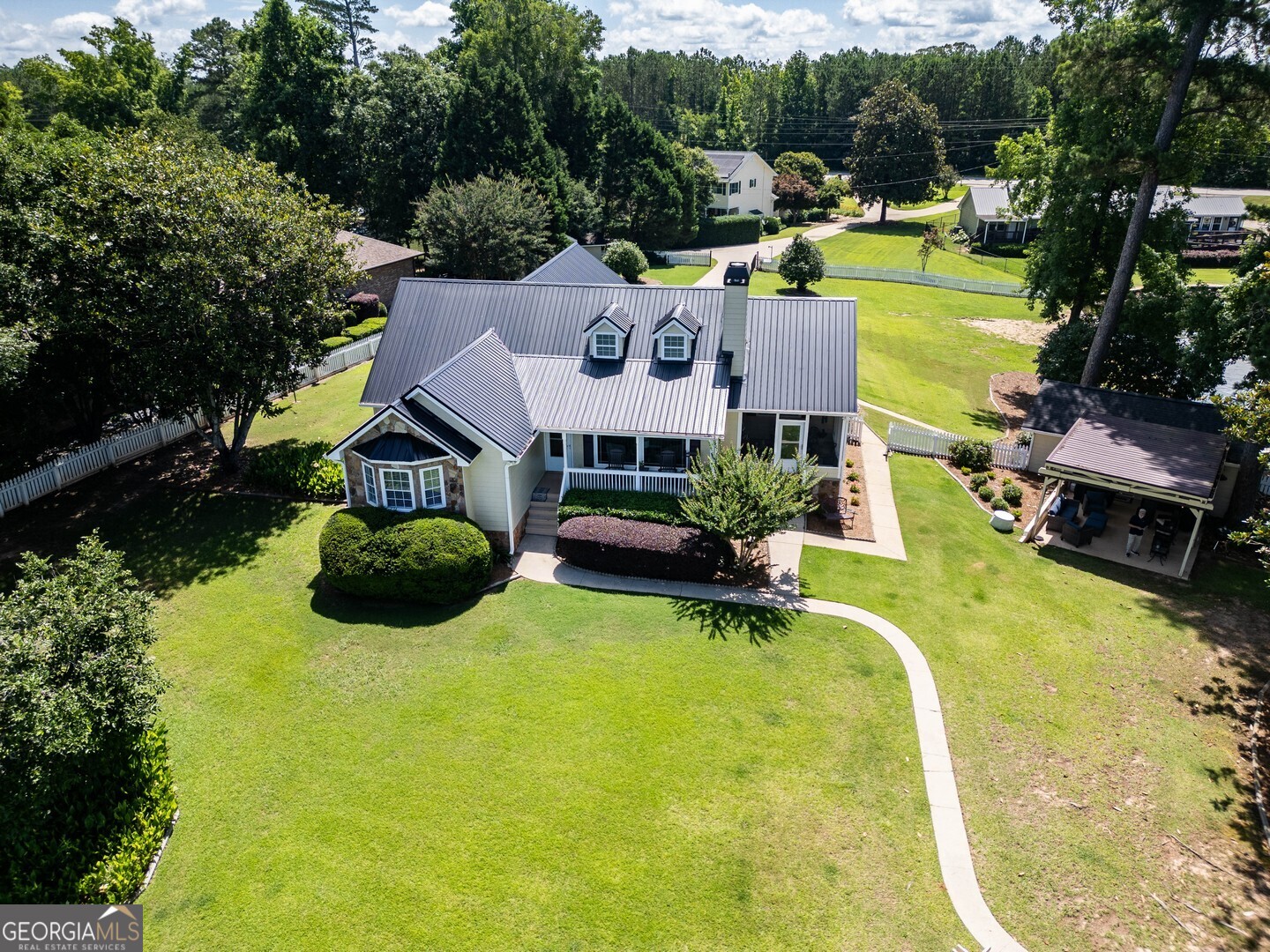 8950 Jackson Lake Road Monticello, GA 31064 - Photo 8 of 88 an aerial view of a house with yard swimming pool and outdoor seating