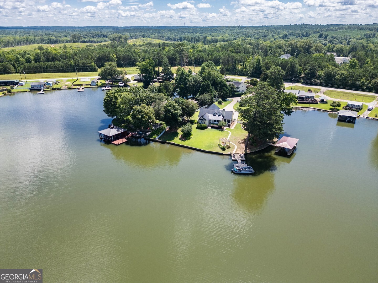 8950 Jackson Lake Road Monticello, GA 31064 - Photo 10 of 88 an aerial view of a houses with a lake view