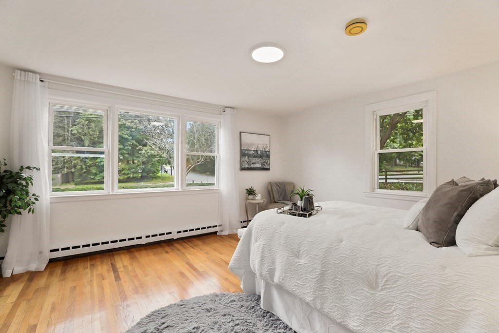 1177 Bay Road Sharon, MA 02067 - Photo 12 of 27 a bed sitting in a bedroom next to a window