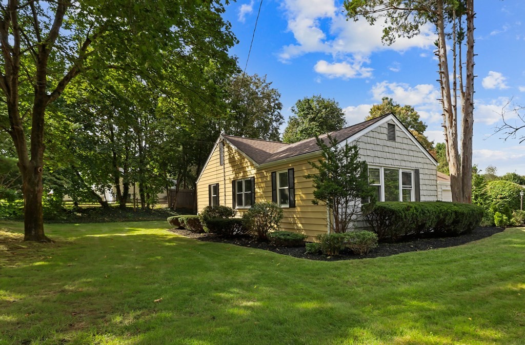 1177 Bay Road Sharon, MA 02067 - Photo 25 of 27 a front view of house with yard and green space