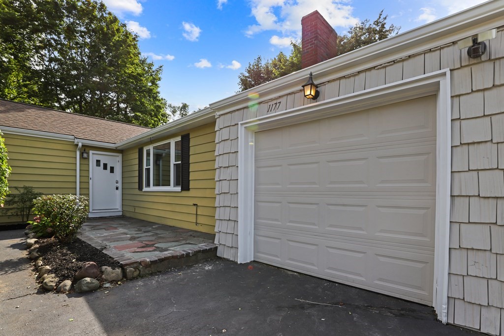 1177 Bay Road Sharon, MA 02067 - Photo 3 of 27 a side view of a house with a garage