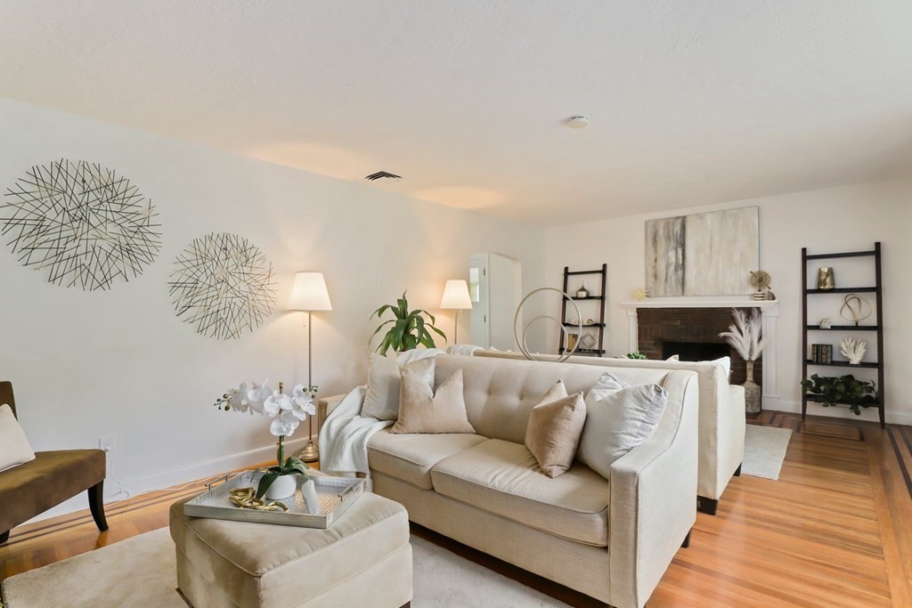 1177 Bay Road Sharon, MA 02067 - Photo 6 of 27 a living room with furniture and a fireplace