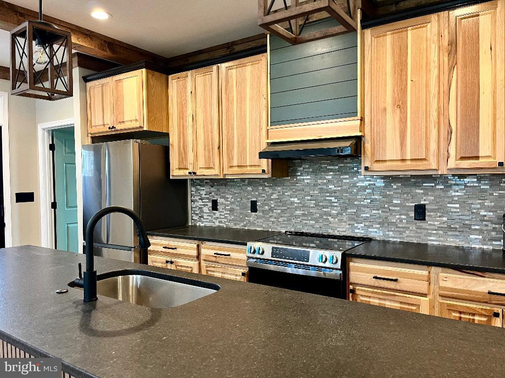 6 Antioch Road Luray, VA 22835 - Photo 34 of 39 a kitchen with granite countertop a sink and a window