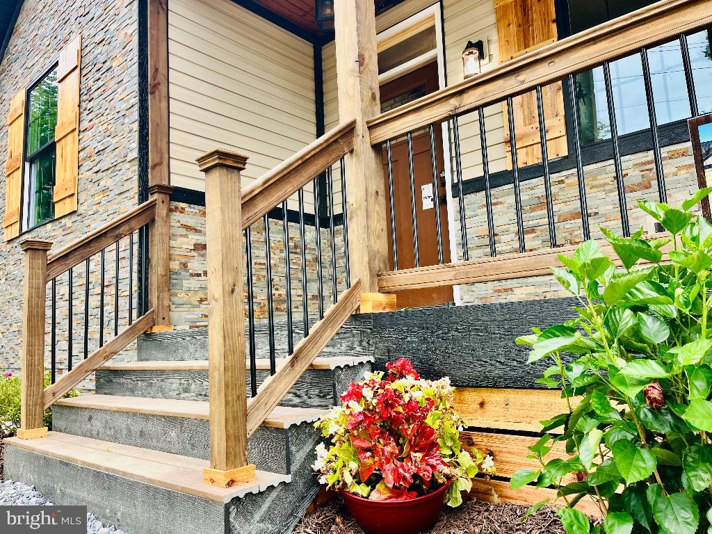 6 Antioch Road Luray, VA 22835 - Photo 6 of 39 front view of a house with a potted plant
