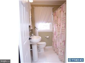 1130 Musket Road Newark, DE 19713 - Photo 8 of 12 a bathroom with a toilet a sink and a mirror