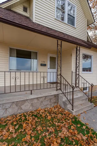 a view of a porch with a floor to ceiling window