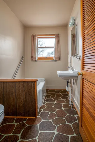 a bathroom with a sink and a mirror