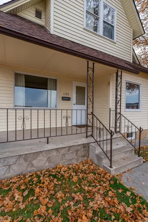 a front view of house with yard and trees