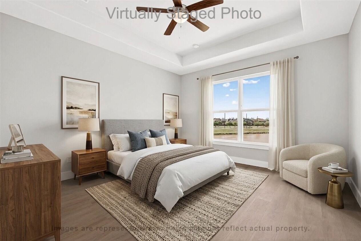 10719 Mason Road, Unit 39 Richmond, TX 77406 - Photo 14 of 50 Virtual Staging - Well-lit bedroom featuring a comfortable bed, warm wood furnishings, and a large window with a scenic view