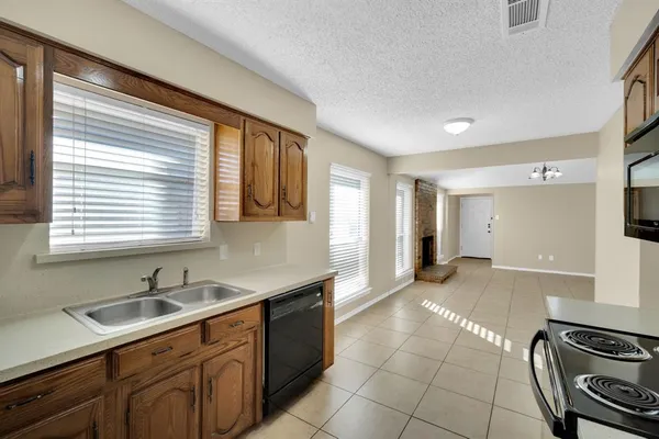 a kitchen with a sink and a stove