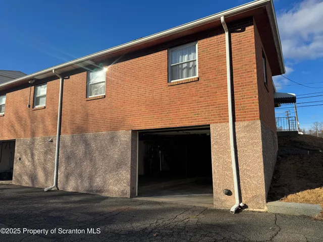a front view of a house with a garage