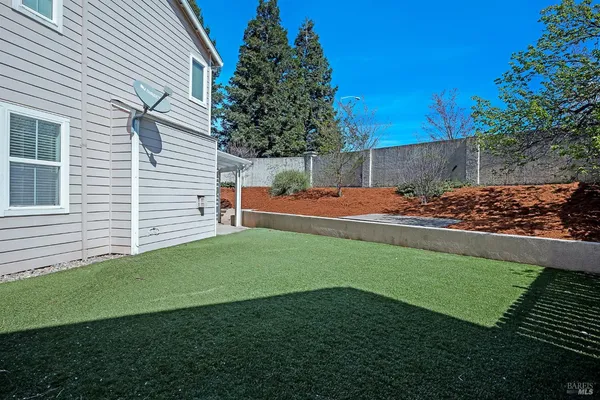 a backyard of a house with lots of green space