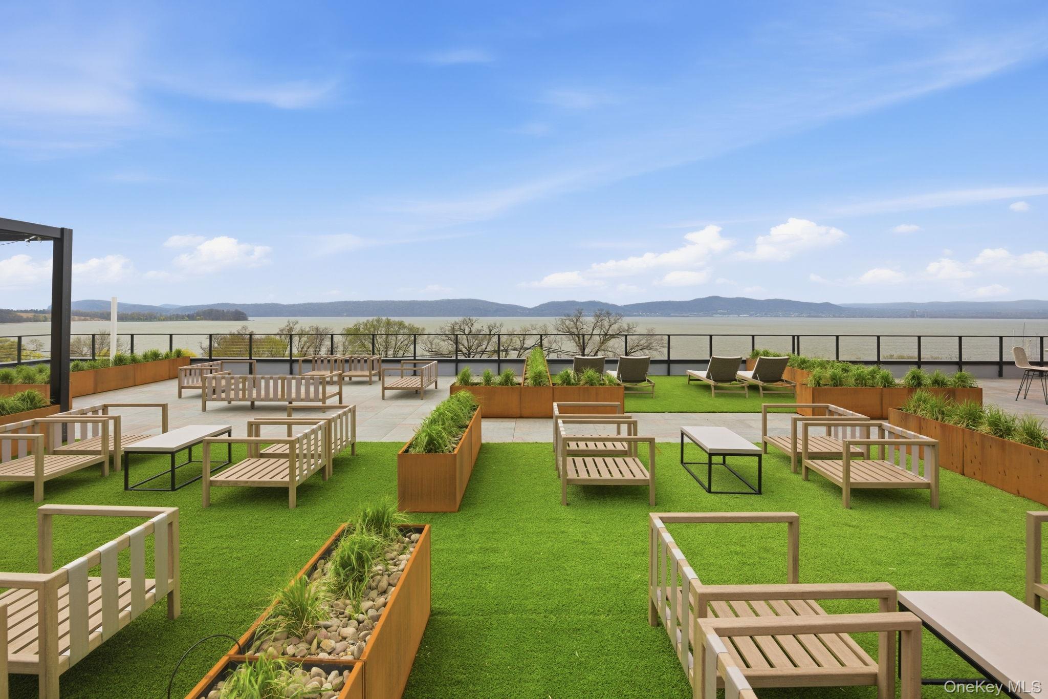 25 South Riverside Avenue, Unit 107 Croton-on-Hudson, NY 10520 - Photo 24 of 42 a view of swimming pool with outdoor seating and city view