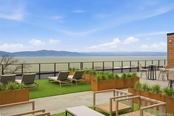 a view of a chairs and table on the terrace