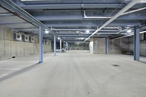 a view of an empty room with a garage
