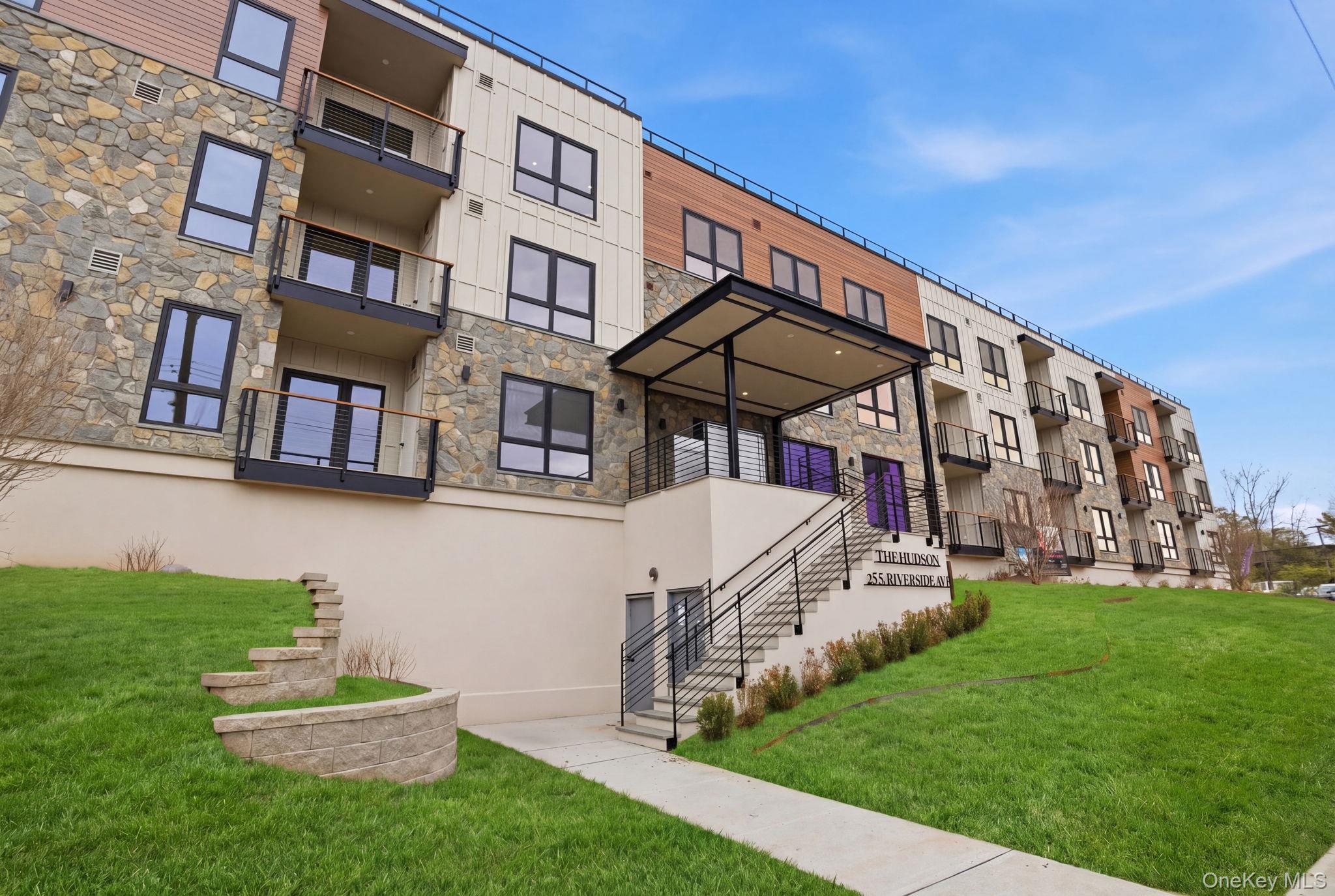 25 South Riverside Avenue, Unit 107 Croton-on-Hudson, NY 10520 - Photo 36 of 42 a front view of a building with a yard