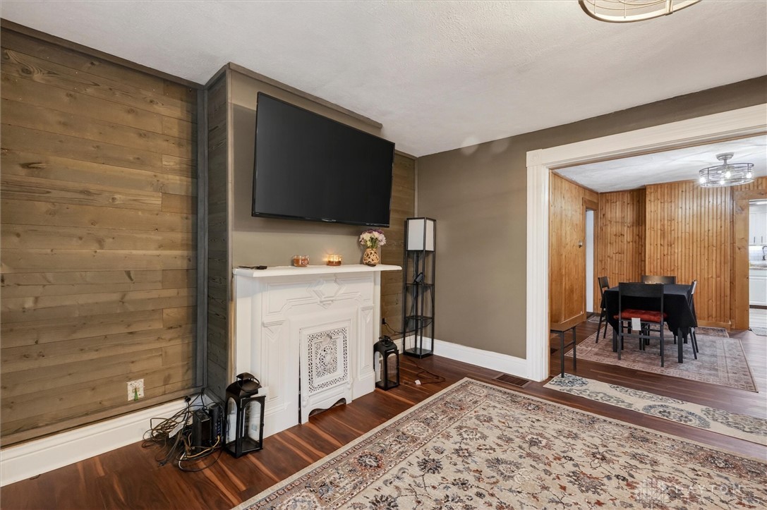 1726 Morgan Street Springfield, OH 45503 - Photo 12 of 30 This inviting living space features rich hardwood flooring and a classic fireplace.