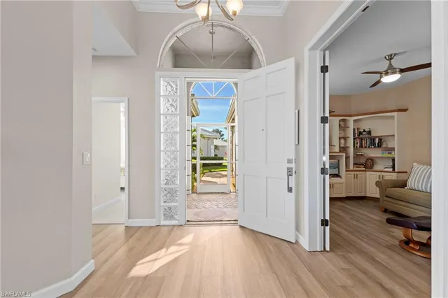 a view of a livingroom with wooden floor and a cabinet