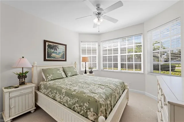 a spacious bedroom with a large bed and a window