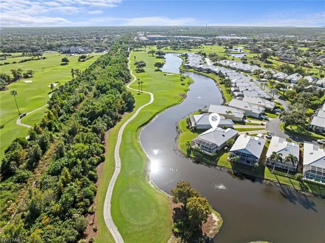 an aerial view of a house with a swimming pool