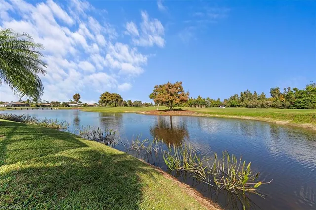 a view of a lake with a big yard