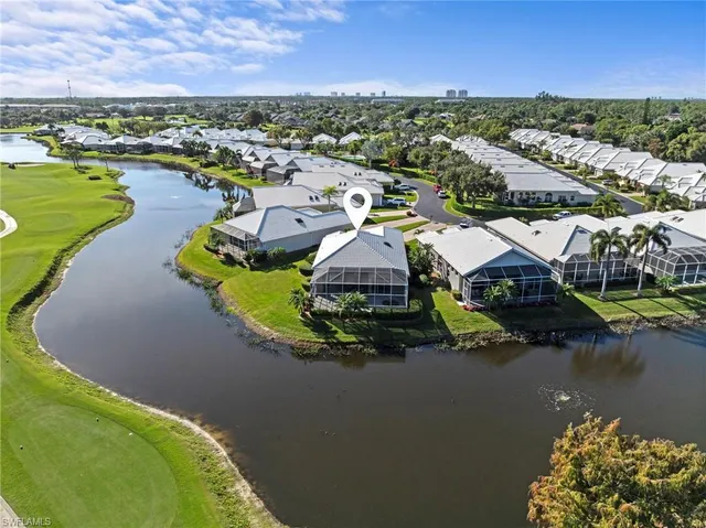 an aerial view of a house with a lake view