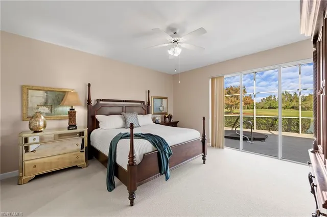 a spacious bedroom with a bed and a large window