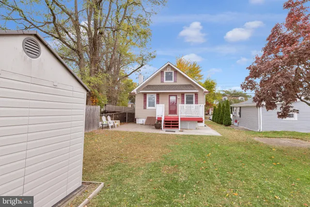 a view of house with outdoor space and sitting area