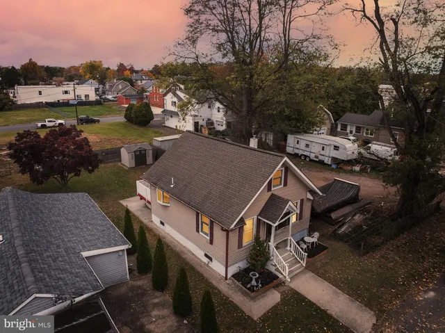an aerial view of a house with garden space and houses view