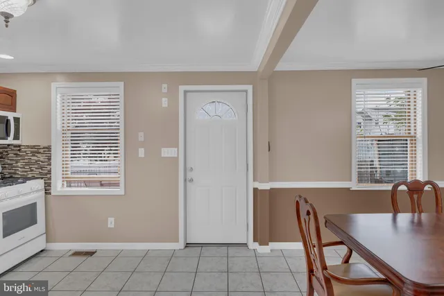 a view of a dining room with furniture and window