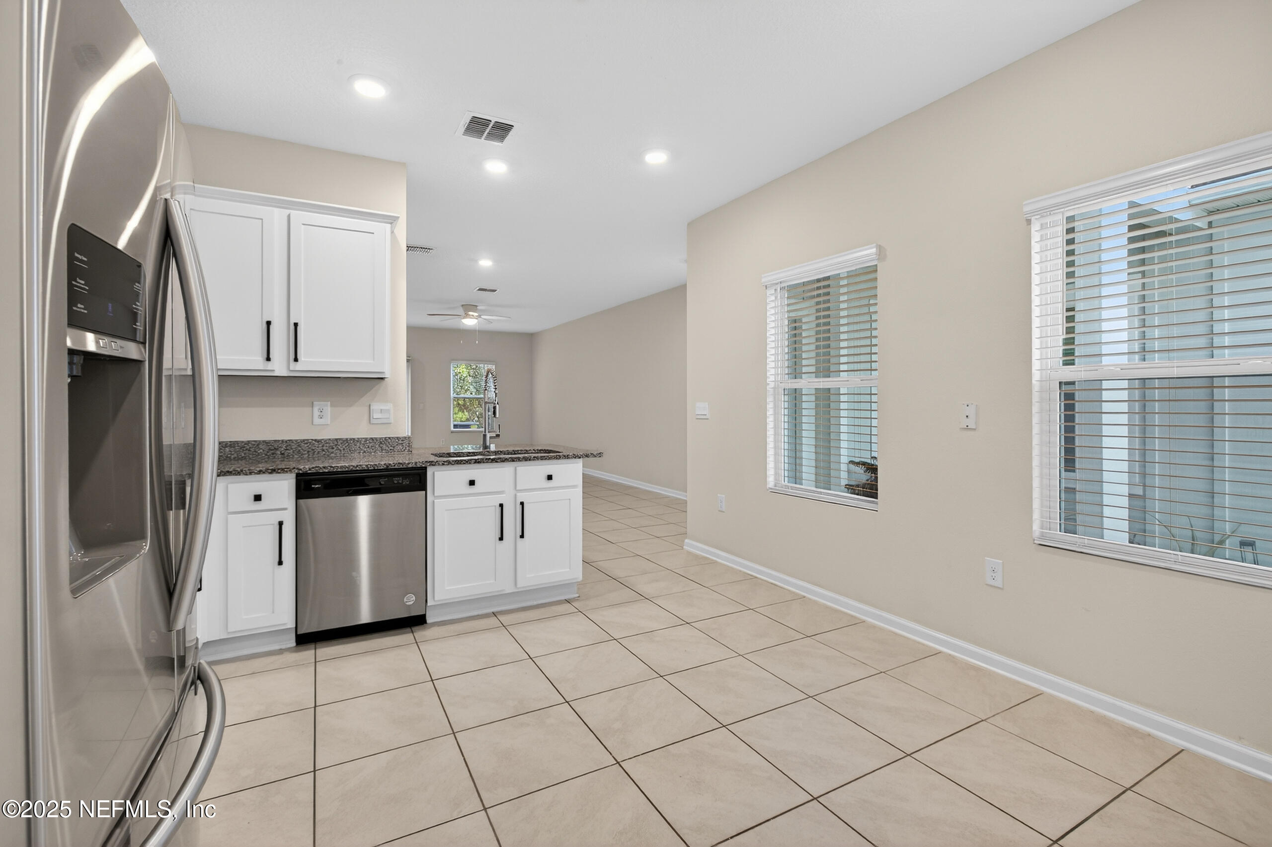 85 Talulla Trail St. Augustine, FL 32095 - Photo 12 of 55 a kitchen with stainless steel appliances granite countertop a stove a sink and a refrigerator