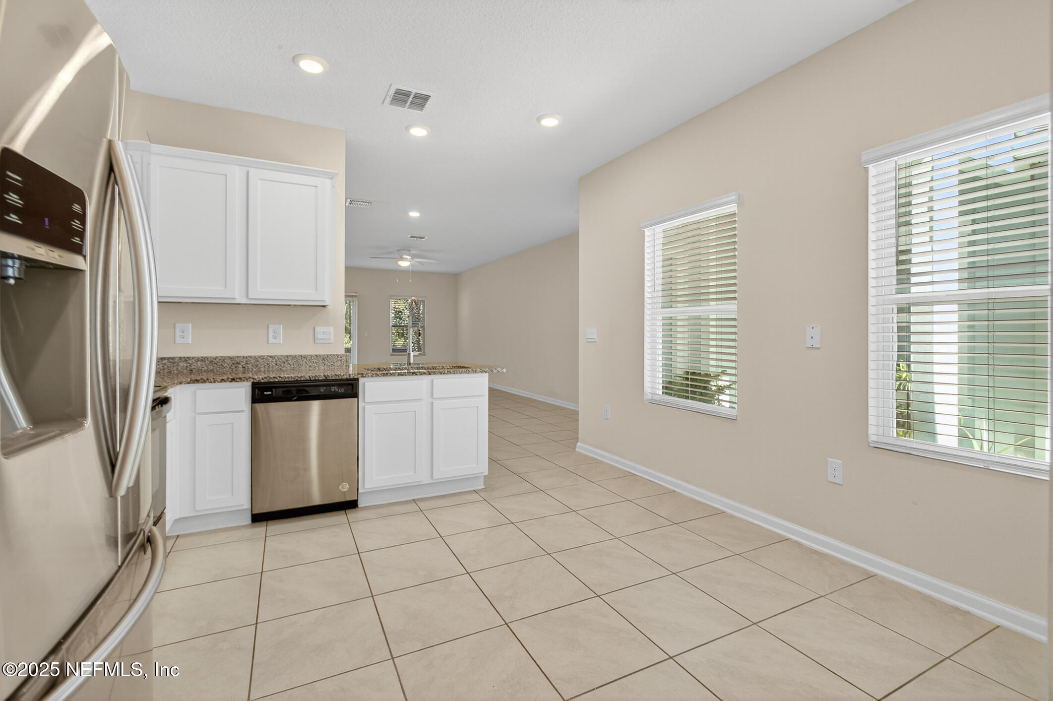 85 Talulla Trail St. Augustine, FL 32095 - Photo 16 of 56 a kitchen with a sink a stove a refrigerator and cabinets