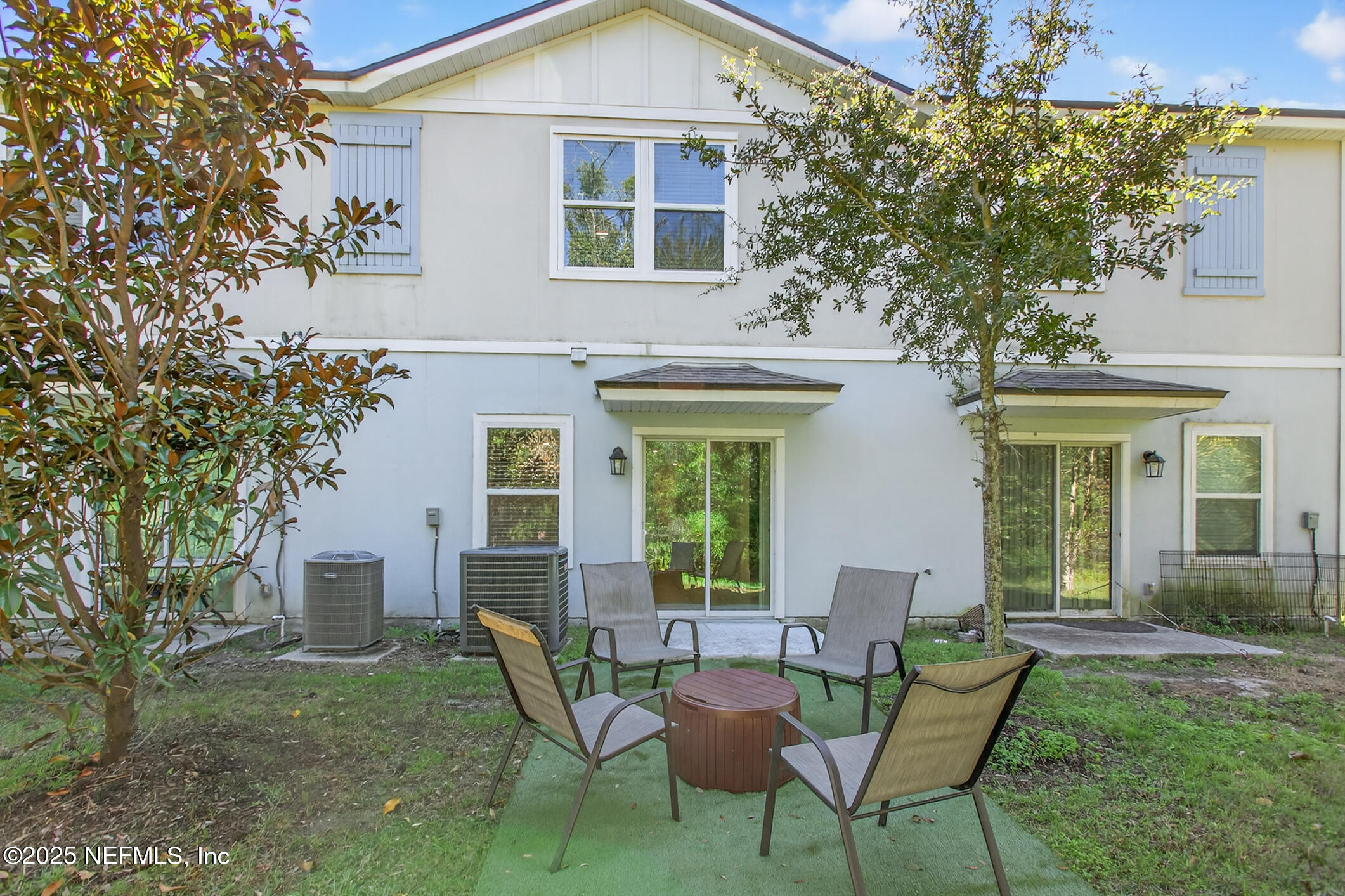 85 Talulla Trail St. Augustine, FL 32095 - Photo 37 of 55 a view of a house with backyard sitting area and garden
