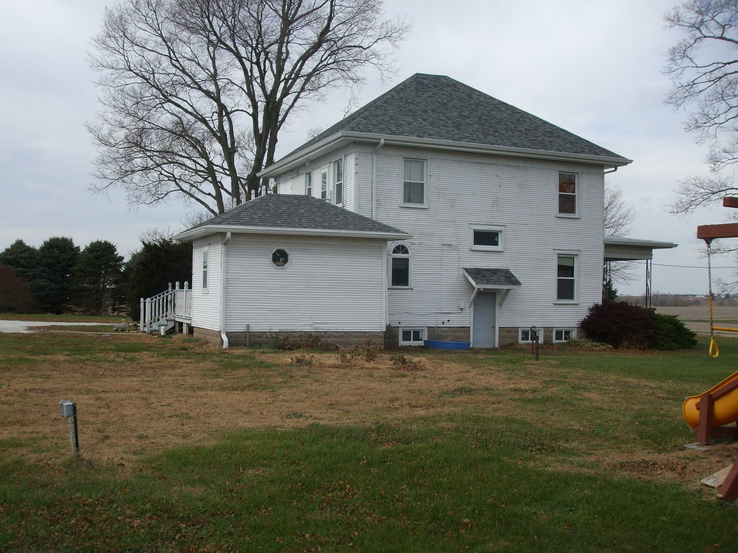 23175 Litwiller Road Delavan, IL 61734 - Photo 2 of 37 a big white house with a yard and big trees