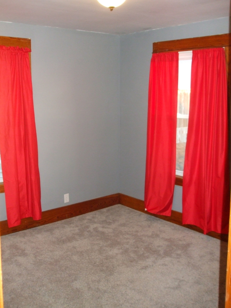 23175 Litwiller Road Delavan, IL 61734 - Photo 25 of 37 a view of a room with red carpet and a closet