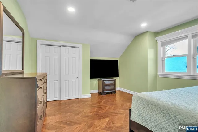 a bathroom with a toilet a sink and a mirror
