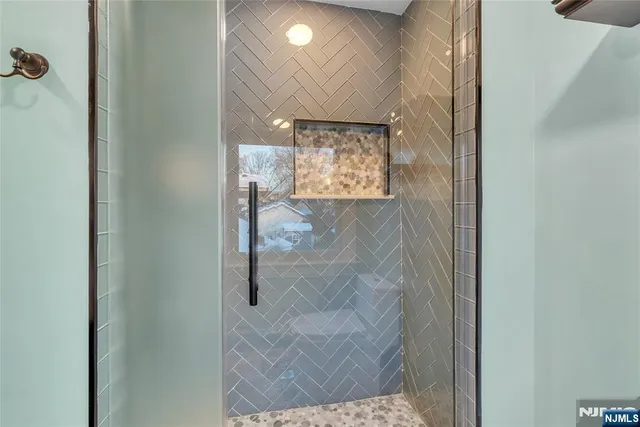 a bedroom with a bed a couch and dresser