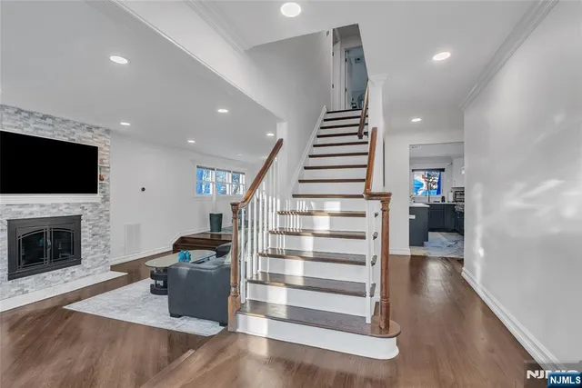 a living room with furniture fireplace and a flat screen tv