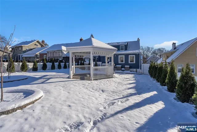 a swimming pool with trees in front of it