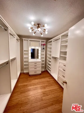 a spacious bedroom with a bed and a table