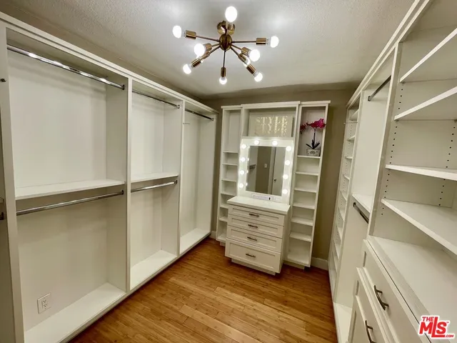 a spacious bedroom with a bed and a window