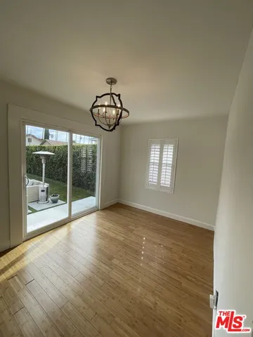 a bathroom with a double vanity sink mirror and bathtub