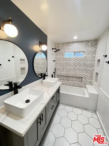 a bathroom with a bathtub and shower
