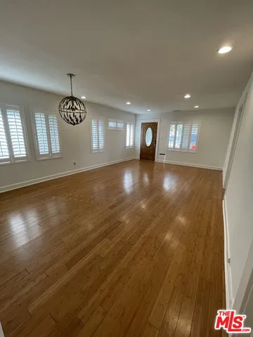 a kitchen with stainless steel appliances granite countertop a refrigerator sink and cabinets