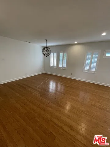 a kitchen with granite countertop cabinets a sink and appliances