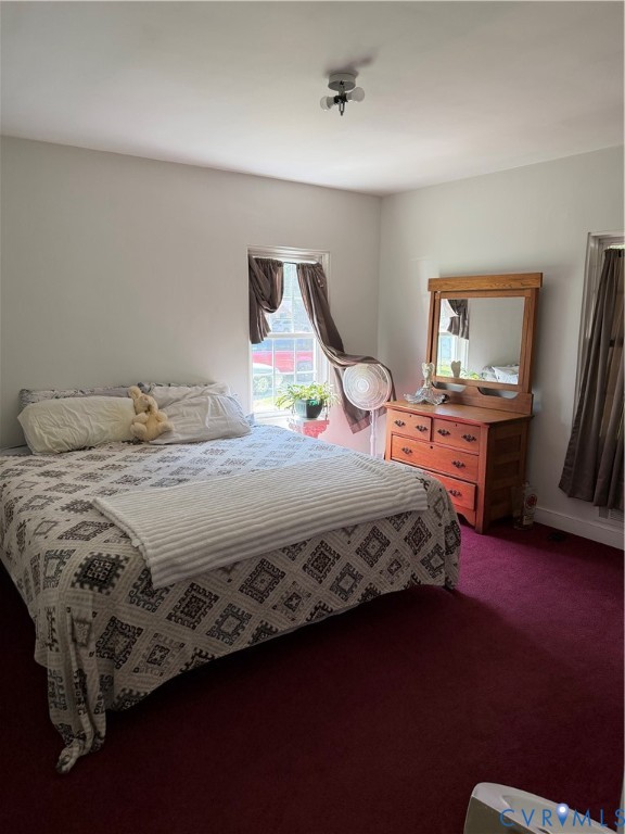 5247 Rockland Road Richmond, VA 23225 - Photo 6 of 9 Bedroom featuring rich burgundy carpeting and ligh