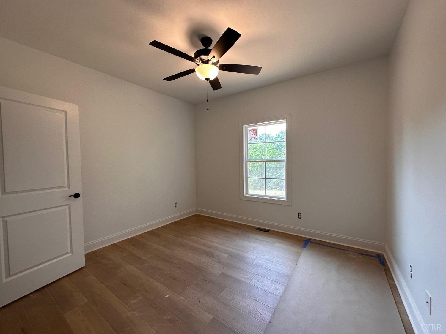 2811 Everett Road Forest, VA 24551 - Photo 26 of 49 an empty room with windows and fan