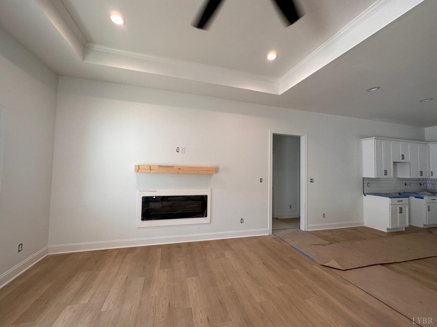 2811 Everett Road Forest, VA 24551 - Photo 5 of 49 a view of kitchen and empty room with wooden floor