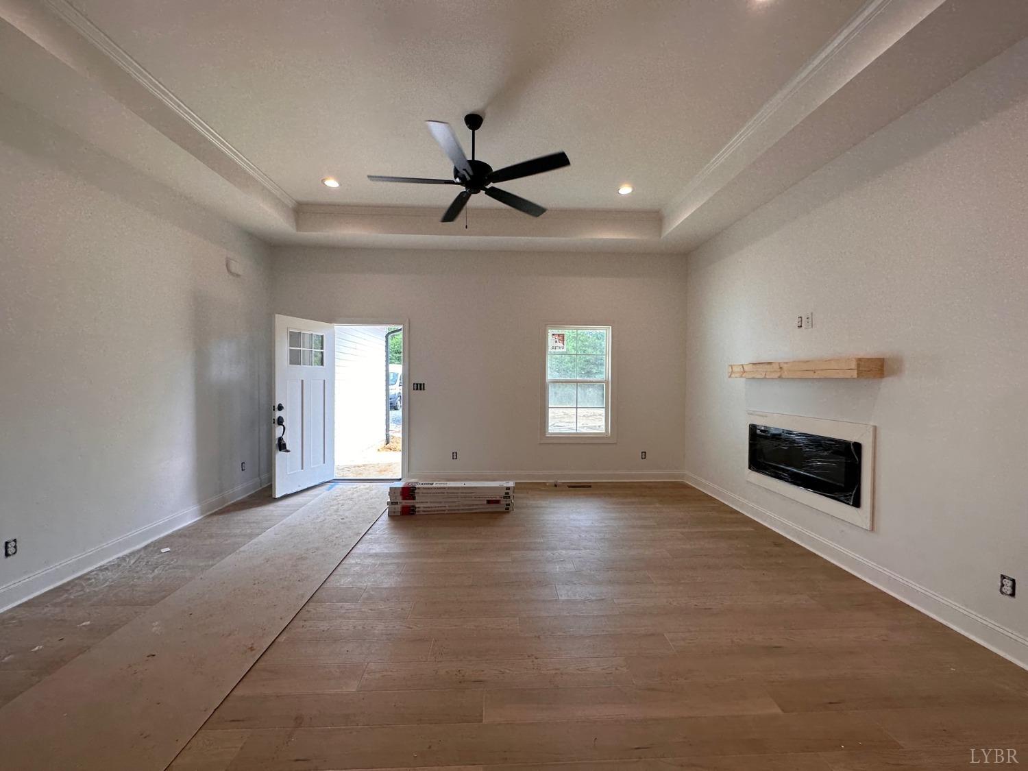 2811 Everett Road Forest, VA 24551 - Photo 8 of 49 an empty room with windows and fireplace